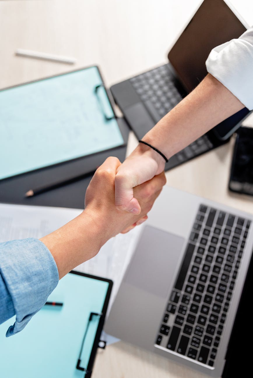 high angle shot of a people doing shaking hands