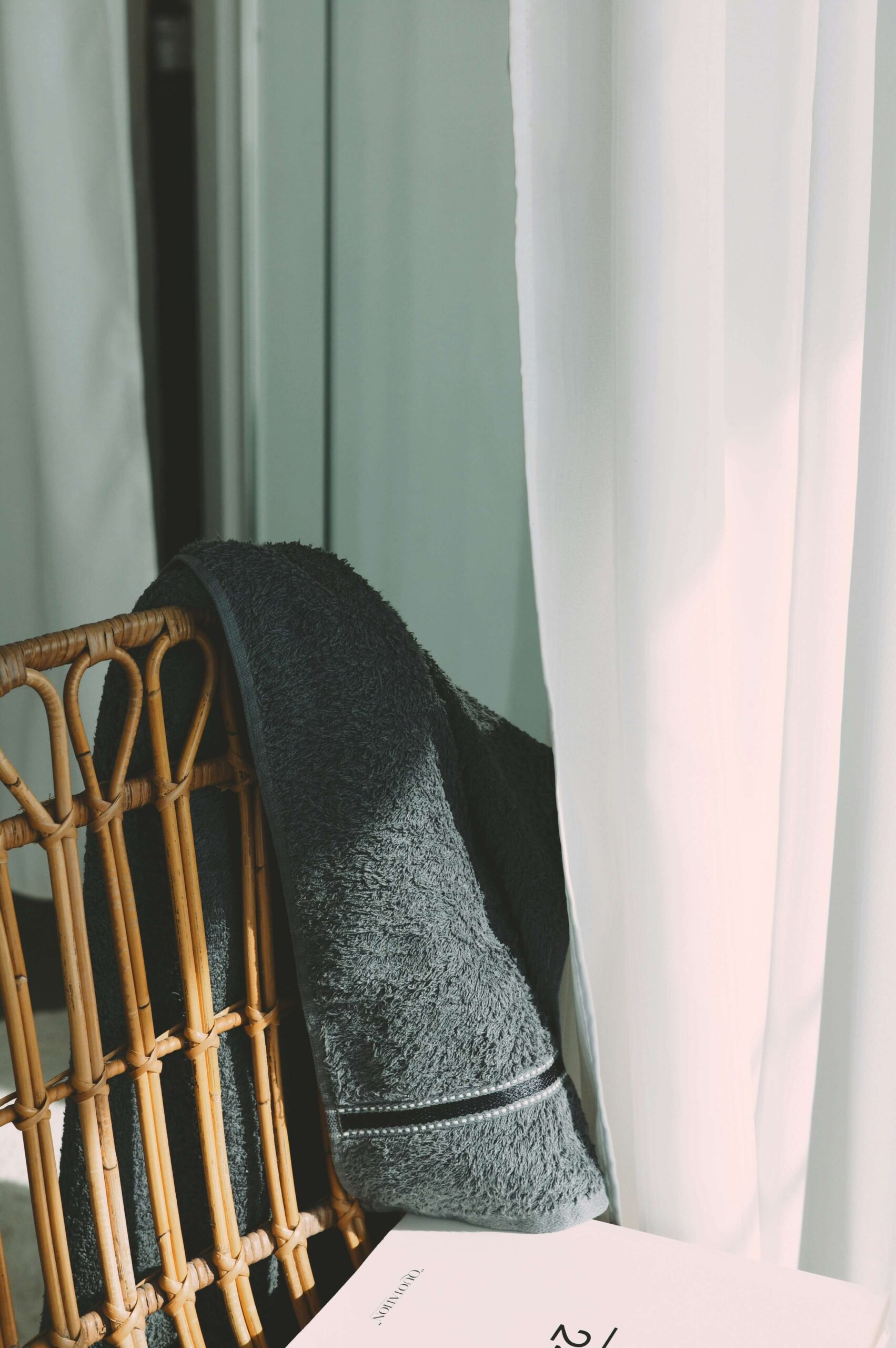 a stack of books sitting on top of a table next to a chair - private 457(b) plan