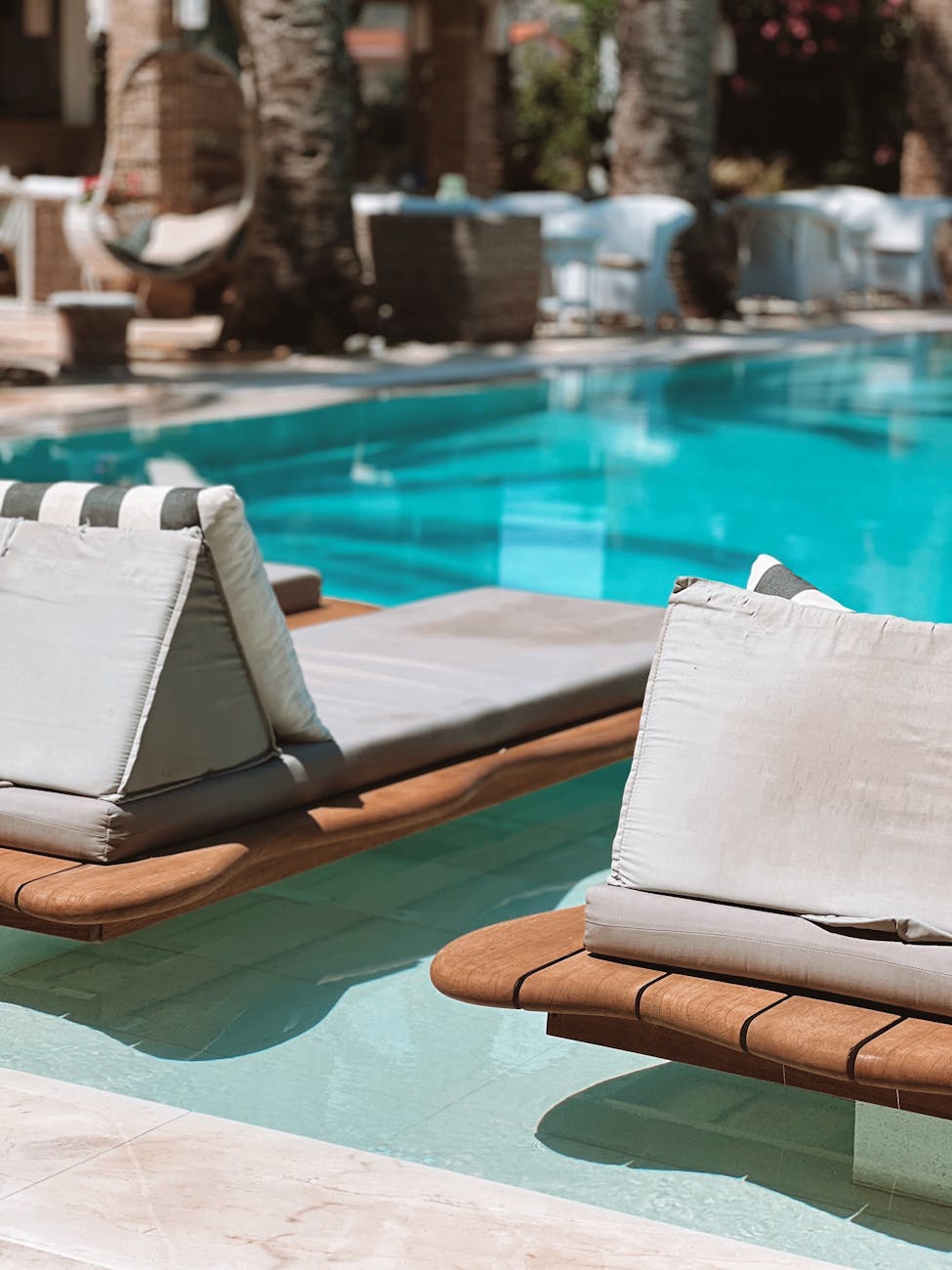 sunbeds floating on water