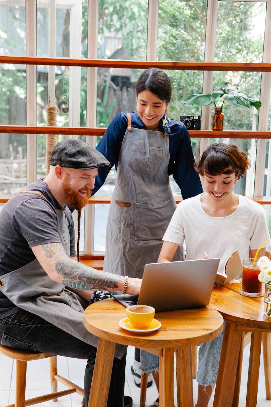 coworkers surfing on computer in cafeteria